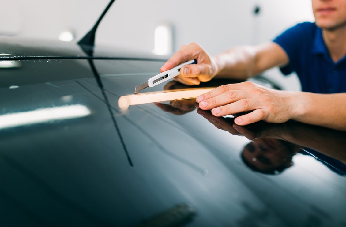 Worker with Blade, Car Tinting Film Installation